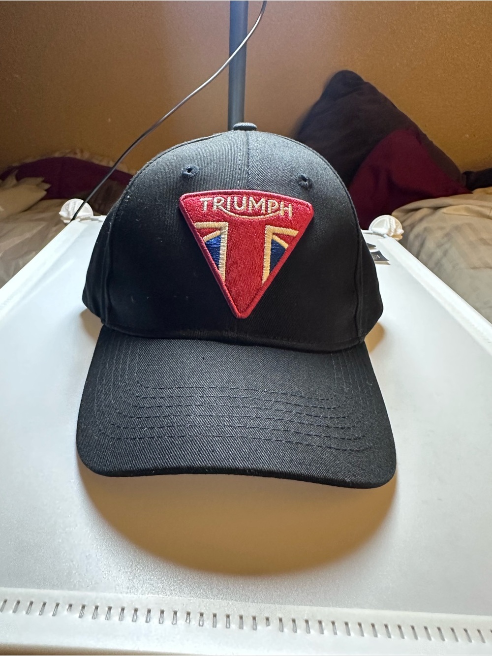 Triumph Black Cap with Red Crest and Blue Accents